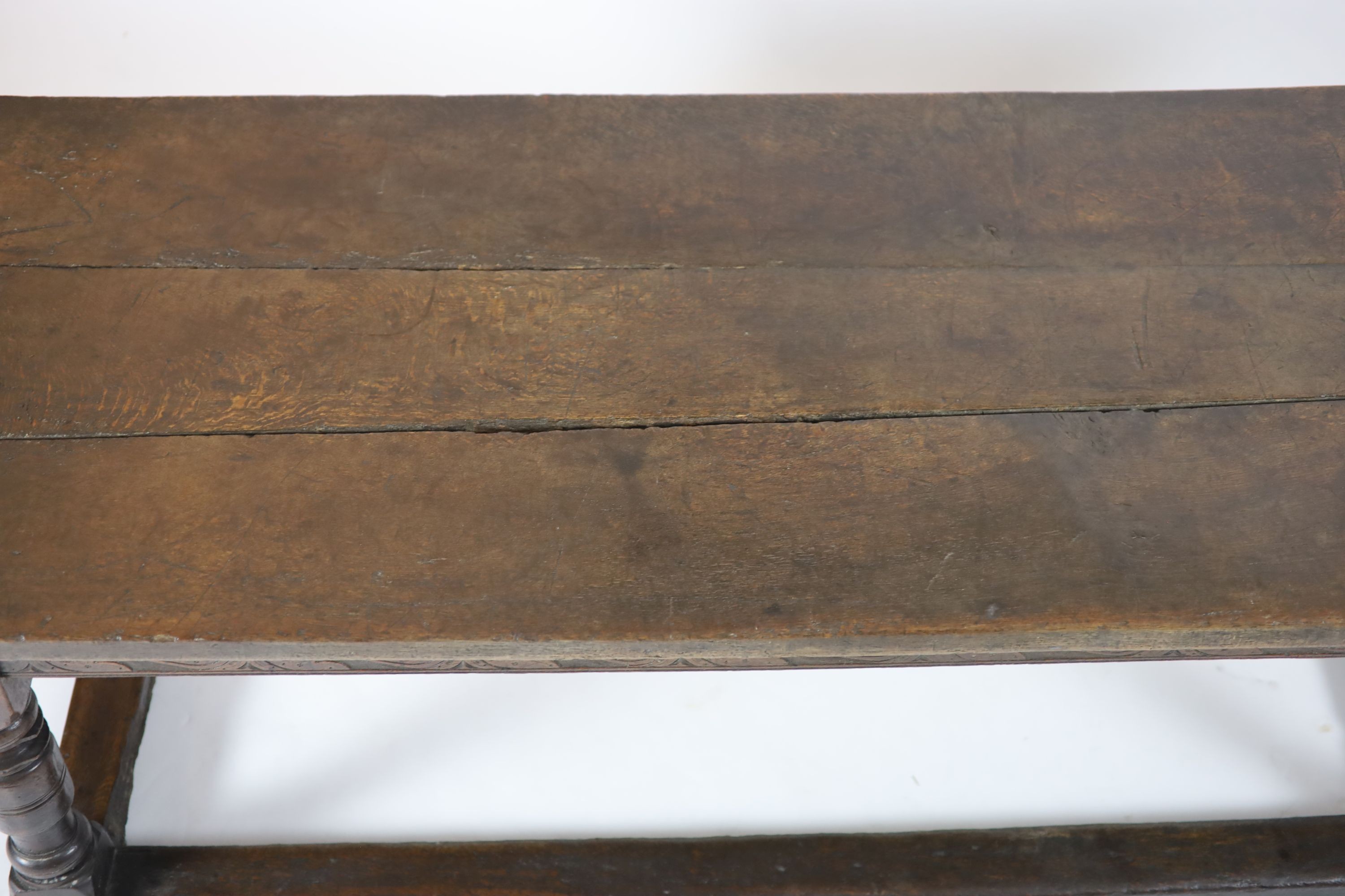 A Charles I oak refectory table, possibly West Country, having three-plank top H 74cm. W 220cm. D 76cm.